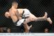 Brian Keller (left) goes for a takedown, but Marlon Vera keeps hold on Kelleher's arm, which he used to get a submission win.