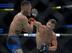 Calvin Kattar (right) swings on Andre Fili