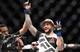 Tyson Pedro gets his hand raised over Khalil Rountree.
