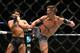 Stephen Thompson (right) kicks Jorge Masvidal