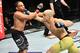 Marlon Moraes (left) hits John Dodson