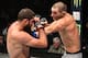 Sean Strickland (right) hits Court McGee