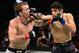 Jason Knight (left) takes a punch from Gabriel Benitez.