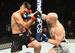 Josh Emmett (right) punches Ricardo Lamas.