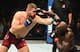 Jared Cannonier (right) exchanges with Jan Blachowicz.