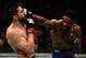 Neil Magny (right) hits Carlos Condit