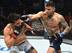 Andre Fili (right) hits Dennis Bermudez.