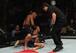 Iuri Alcantara (top) punches Joe Soto as referee Osiris Maia looks on.