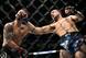 Brian Ortega (right) hits Frankie Edgar.