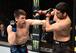 Alexander Hernandez (left) hits Beneil Dariush.