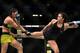 Cat Zingano (right) lands a kick on Ketlen Vieira. Vieira went on to win by decision.