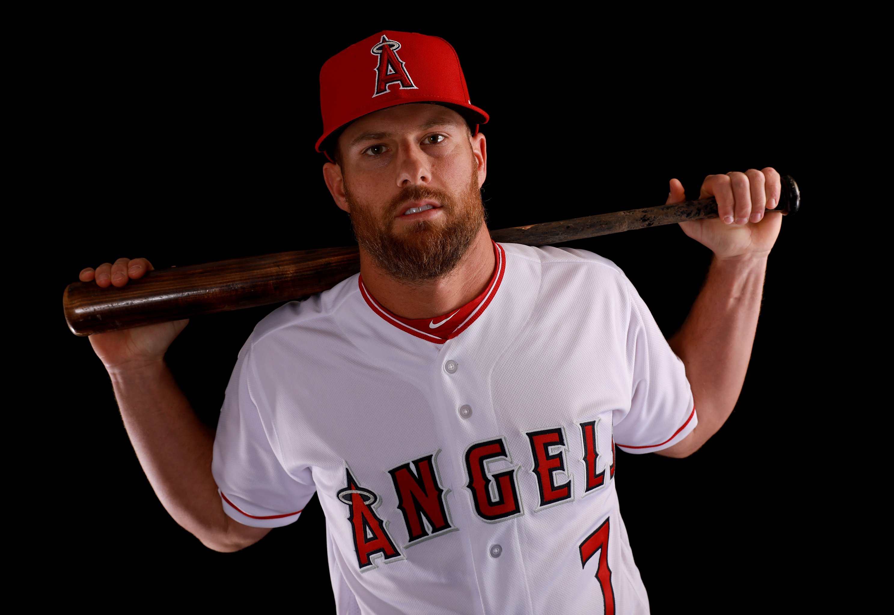 Los Angeles Angels' Jake Lamb is congratulated by third base coach