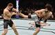 Zabit Magomedsharipov (right) kicks Kyle Bochniak.