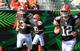 Brandon Weeden (3) and Colt McCoy (12)