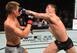 Darren Till (right) hits Stephen Thompson