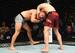 Mads Burnell (bottom) attempts to escape Arnold Allen's choke.