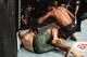 Magny (top) punches Craig White.