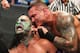 Randy Orton attempting to rip one of Jeff Hardy's earrings out.