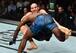 Anderson (blue shorts) takes down Glover Teixeira.