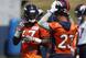 Denver Broncos running backs Royce Freeman (37) and Devontae Booker (23)