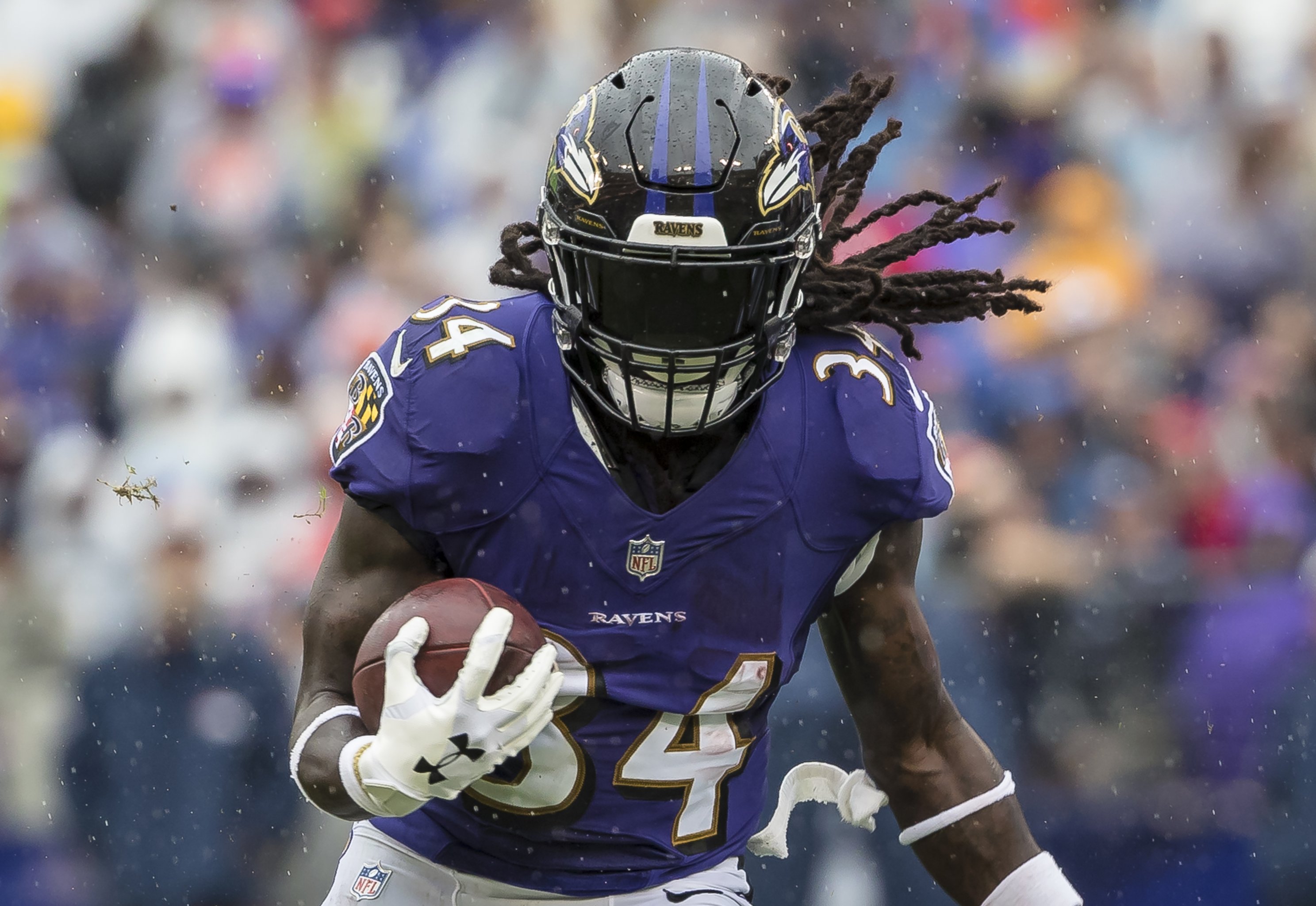 Why Running Back Alex Collins Wears a Super Dark Facemask Visor