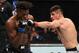 Vicente Luque (right) hits Jalin Turner