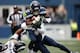 Chris Carson battled his way through the Rams defense.