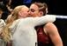 Valentina Shevchenko (left) embraces sister Antonina after Antonina wins her UFC debut.