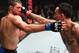 Max Holloway (right) punches Brian Ortega