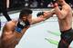 Dhiego Lima (left) lands on Chad Laprise
