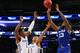 Ashton Hagans (2) and Keldon Johnson (3)