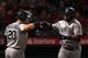 Daniel Vogelbach (L) and Edwin Encarnacion (R)