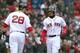 J.D. Martinez (L) and Mookie Betts (R)