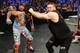 Xavier Woods trying to help Kofi Kingston.