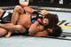 Kron Gracie (right) goes to work on Alex Caceres