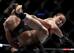 Weili Zhang (right) kicks Tecia Torres