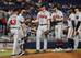 Brian Snitker (L) and Mike Soroka (C)