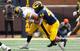 Cameron McGrone (44) brings down Nate Stanley