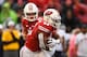 Wisconsin RB Jonathan Taylor (23) and QB Jack Coan (17)