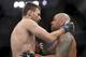 Tim Means (left) embraces Thiago Alves after their bout.