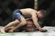 Bryce Mitchell (top) works on Matt Sayles.