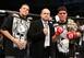 Nate Diaz (left) and Nick Diaz (right) flank Strikeforce founder Scott Coker (center).