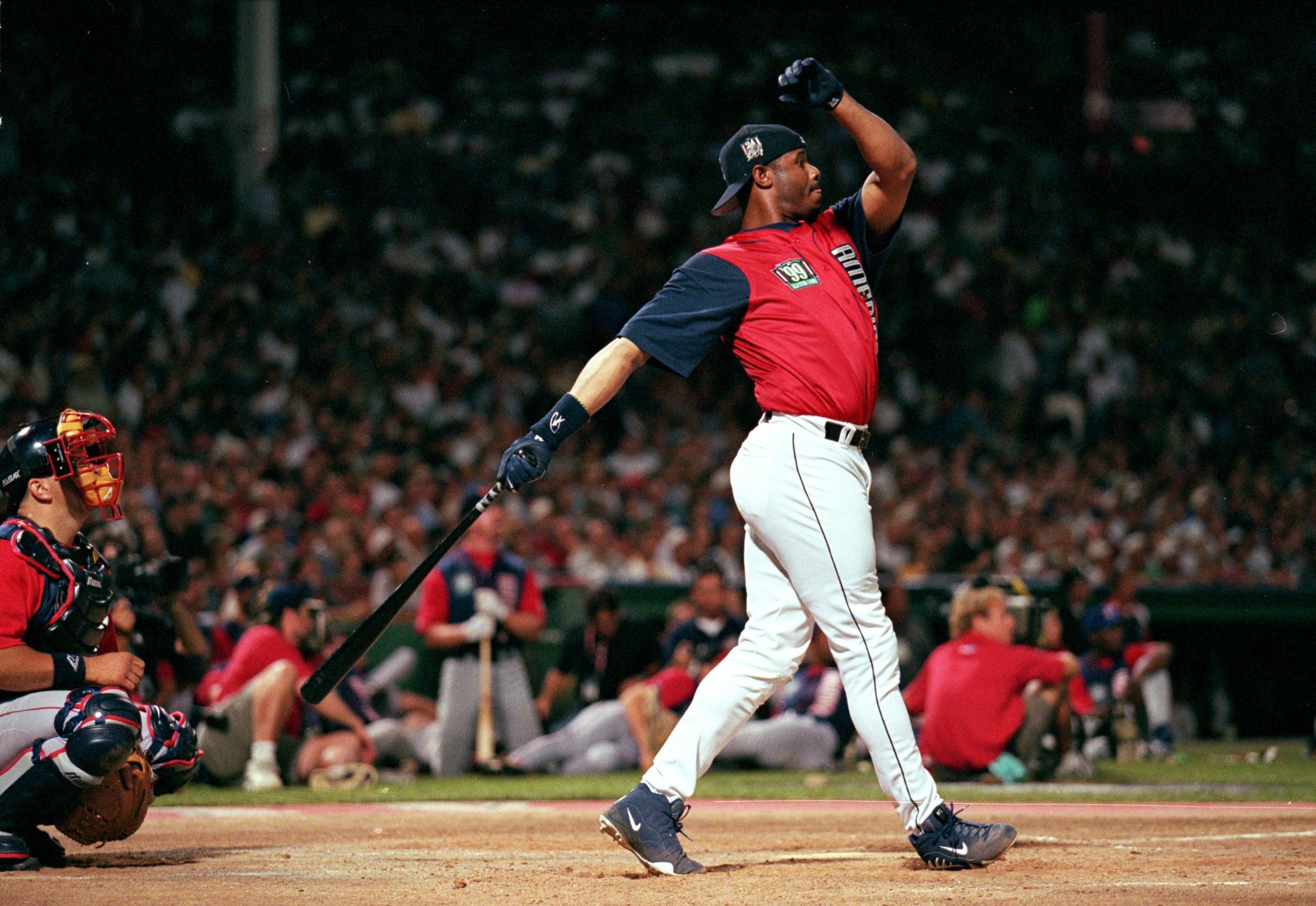 Team USA players watch in awe as MLB-great Ken Griffey Jr. takes