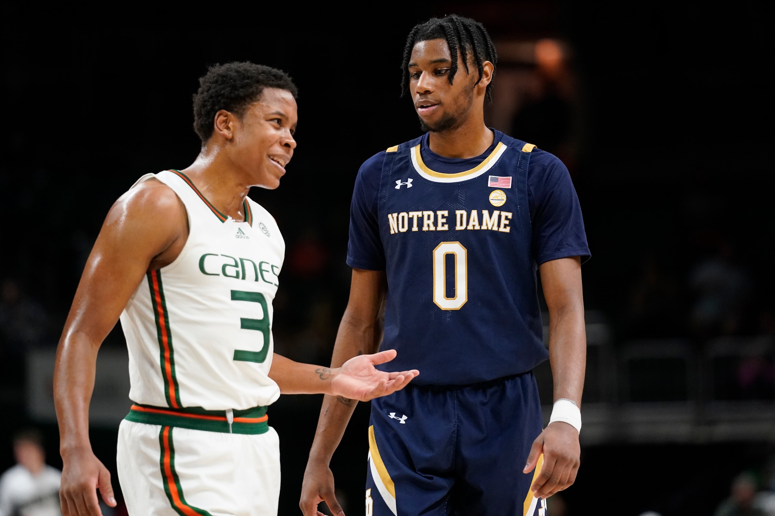 Miami's Charlie Moore and Notre Dame's Blake Wesley