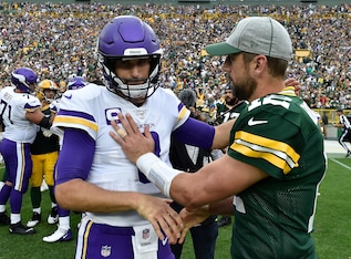 Minnesota Vikings QB Kirk Cousins (left) and Green Bay Packers QB Aaron Rodgers (right) Minnesota Vikings QB Kirk Cousins (left) and Green Bay Packers QB Aaron Rodgers (right)