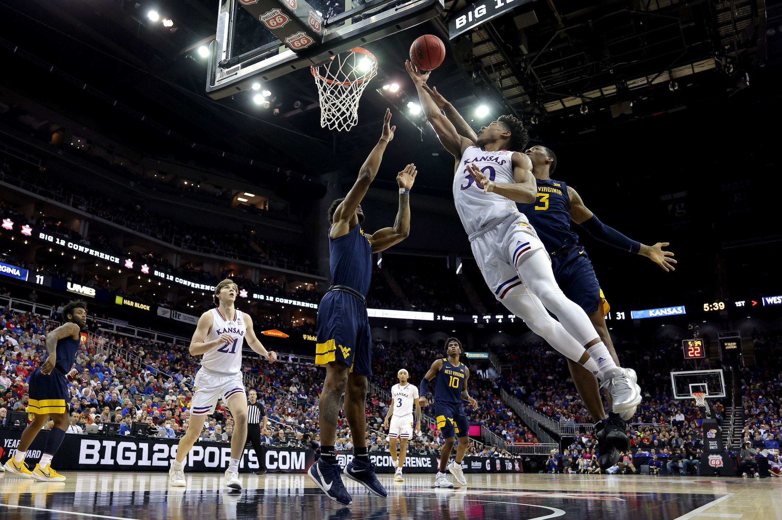 Kansas star Ochai Agbaji (with ball)