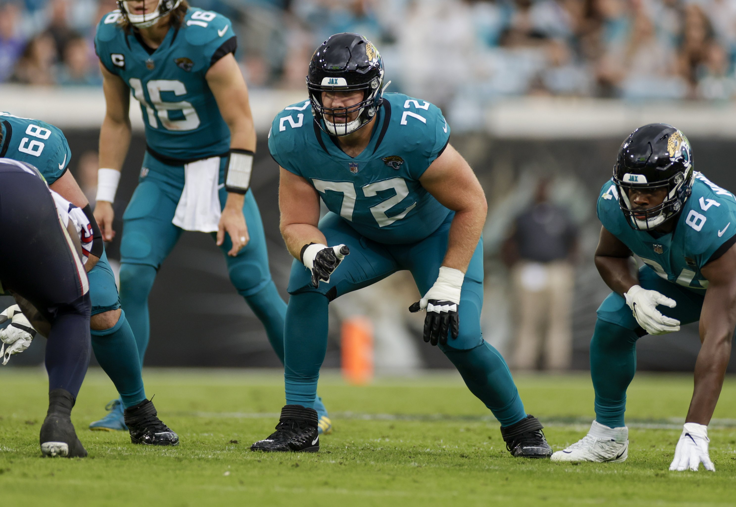 Miami Dolphins offensive tackle Liam Eichenberg (74) and offensive tackle Robert  Hunt (68) walk onto the field during the second half of an NFL football  game against the New York Jets, Sunday